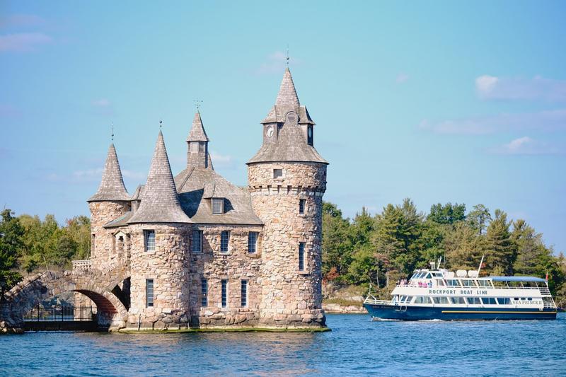 A tour boat passing the Boldt Castle power house in the Thousand Islands