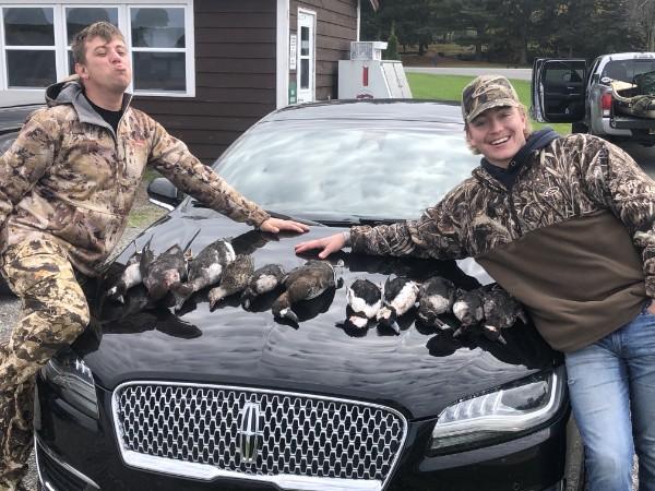Two duck hunters with a morning's limit of ducks