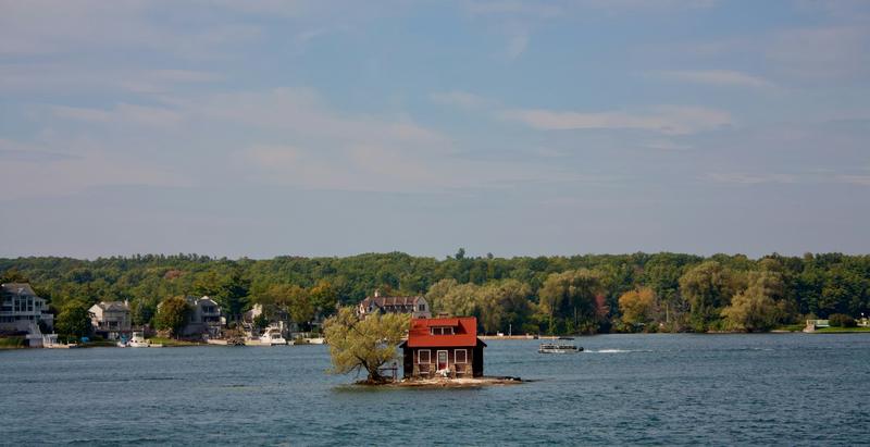 A tiny island in the Thousand Islands with room for just one cottage and a tree